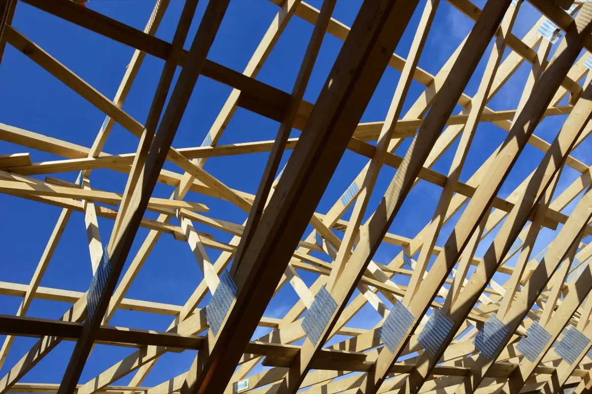 Bare rafters and panel decking on a house in Garden Grove, CA before the covering goes back on